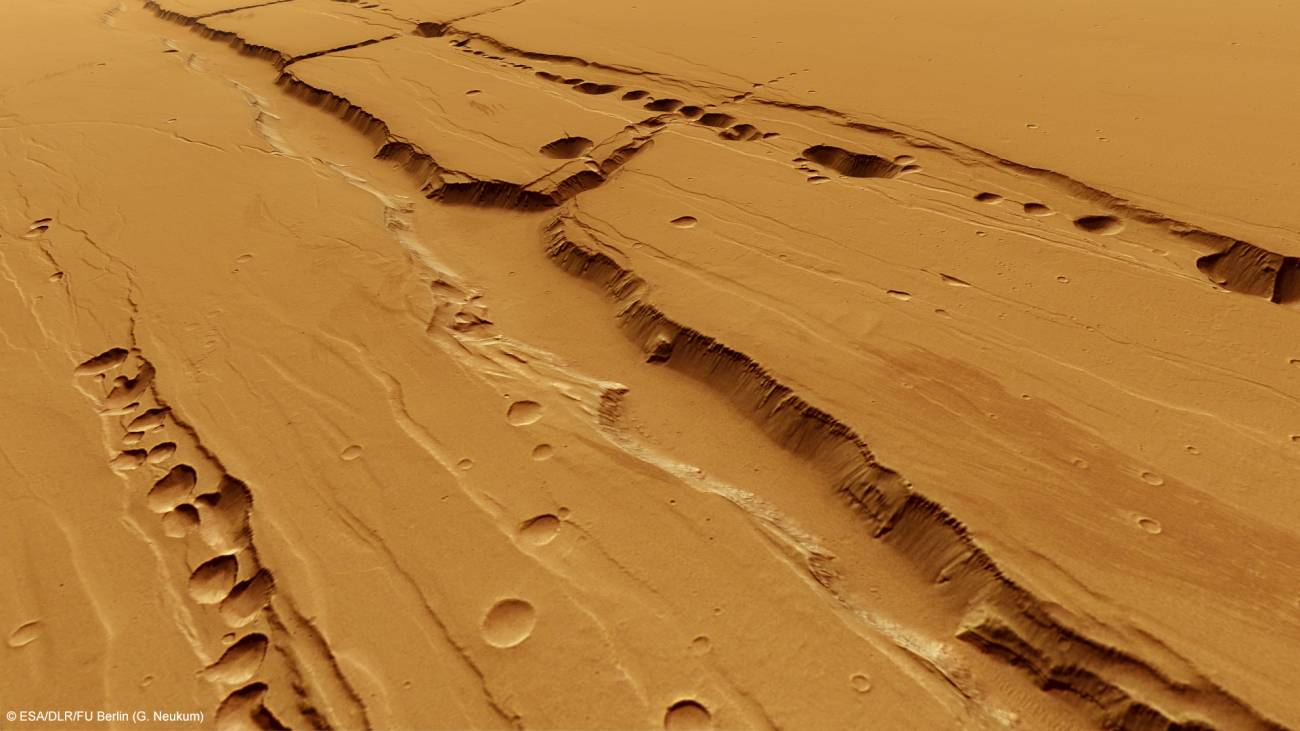 Cadenas de cráteres de subsidencia en Tharsis. Imagen: ESA/DLR/FU Berlin (G. Neukum).  