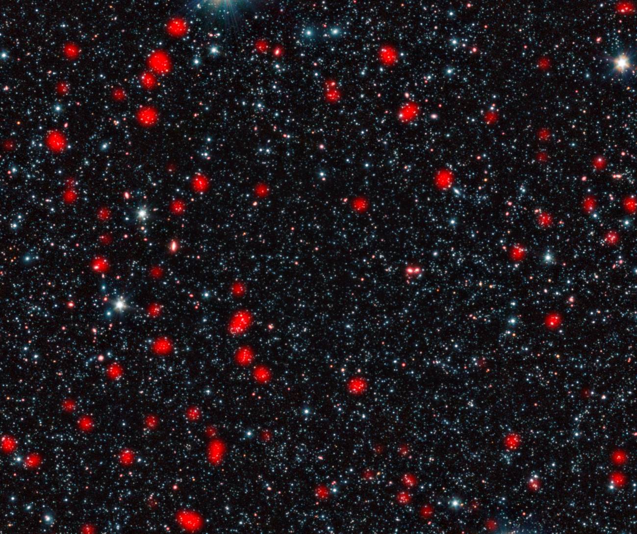 Galaxias distantes con estrellas en  formación en el universo temprano. Imagen: ESO, APEX, A. Weiss et al., NASA Spitzer S.C.