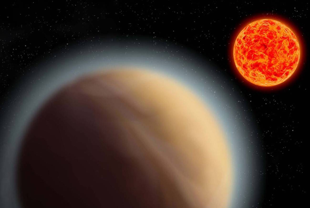 Representación artística de un exoplaneta con espesa atmósfera orbitando alrededor de una enana roja. / MPIA
