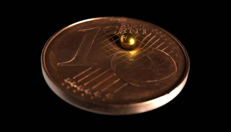 esfera oro moneda un céntimo gravedad