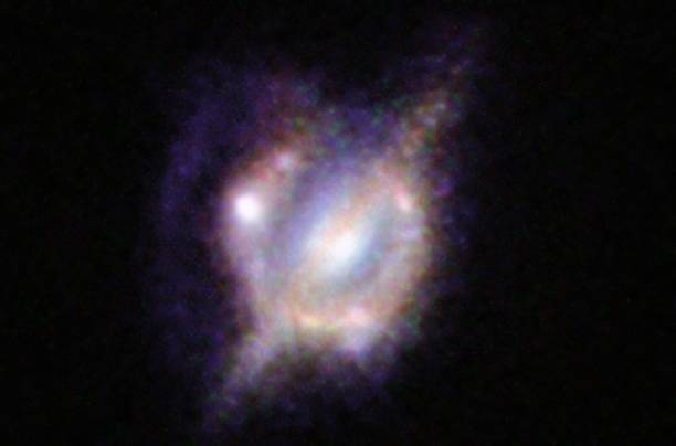 La imagen de la fusión, que combina las vistas desde el telescopio espacial Hubble de NASA/ESA y el telescopio Keck II en Hawái. / ESO-NASA-ESA-W. M. Keck Observatory